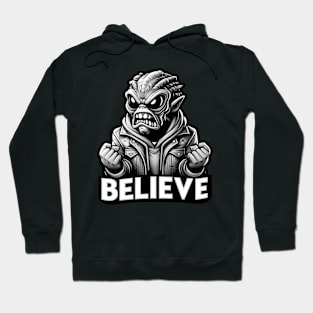 Furious alien monster with the text believe in black and white Hoodie